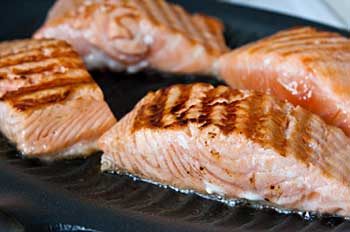 Filets of salmon being roasted